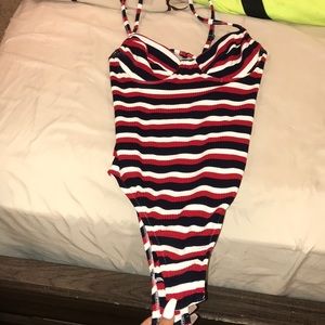 A red, white, and blue bodysuit.